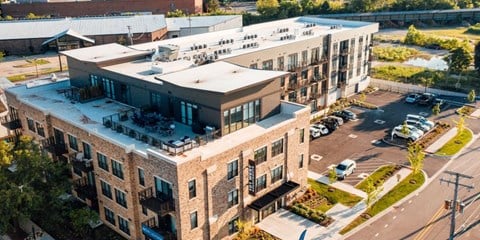 an aerial view of an apartment building with a parking lot at Barrington 101, Barrington, 60010