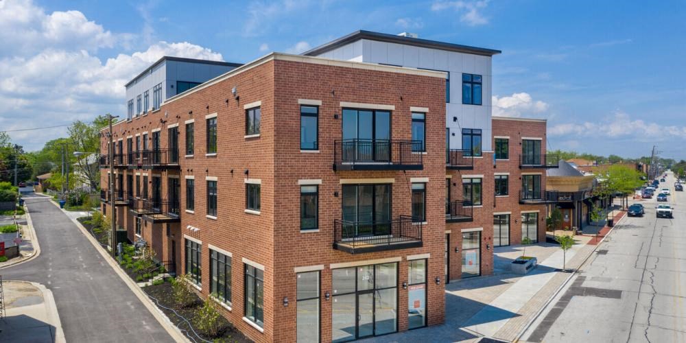 a large brick building on the side of a street  at Highwood 246, Highwood