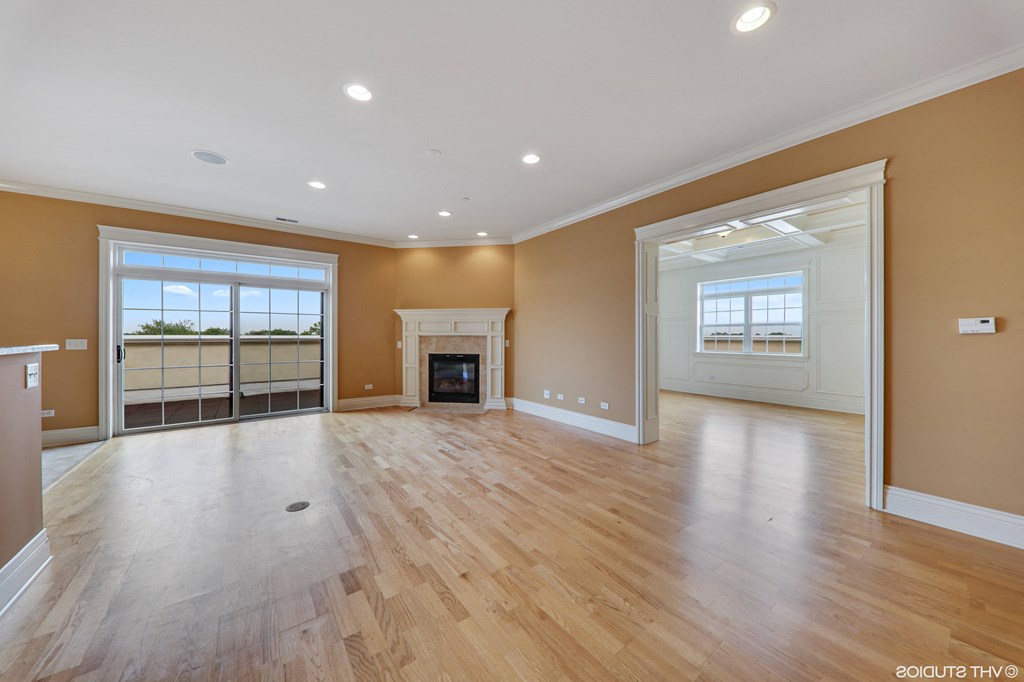 an empty living room with wood floors and a fireplace  at Countryside 10765, Countryside, 60525