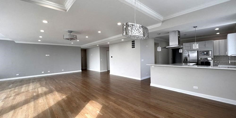 a living room and kitchen with a wood floor  at Lavergne 4810, Illinois