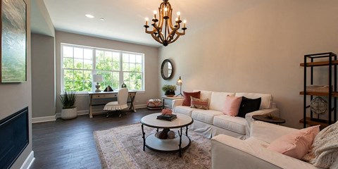 a living room with a white couch and a table