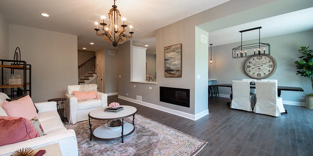 a living room with a fireplace and a table at Countryside Townhomes, Countryside, 60525