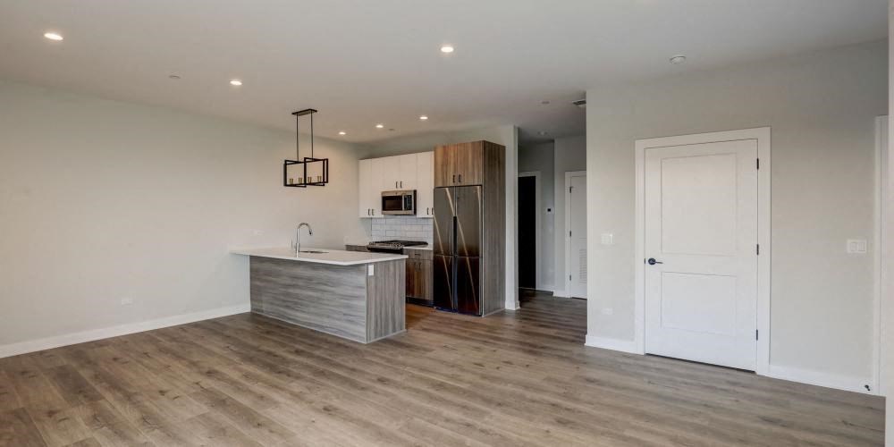 a kitchen with a stainless steel refrigerator and a counter top at Highwood 440, Highwood, IL 60515
