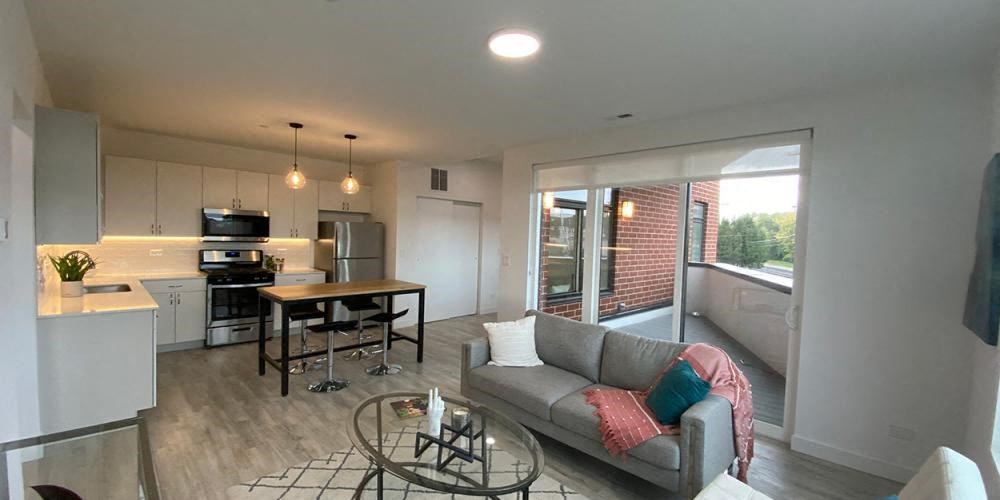 a living room and kitchen with a couch and a table at Highwood 546, Highwood, 60040