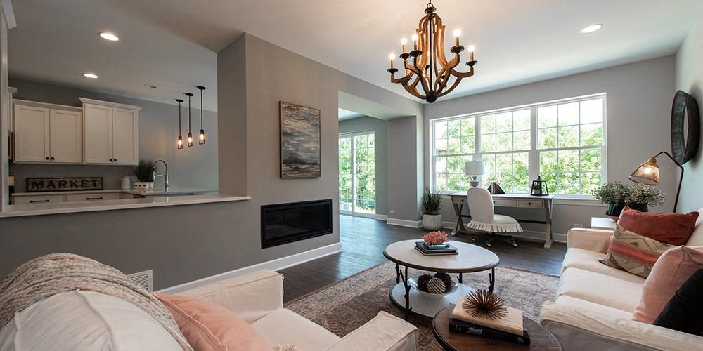 a living room with a couch and a table at Countryside Townhomes, Countryside, IL 60525