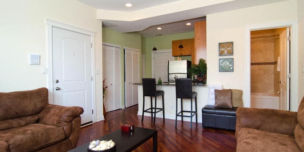 a living room and dining room with rainbow colored lights at Tripp 4321, Chicago, 60641