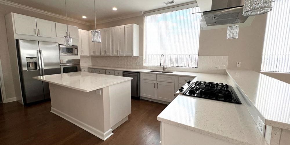 a large white kitchen with a stove and a sink  at Lavergne 4810, Chicago, IL