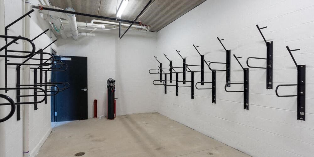 a room with pipes on the wall and a blue door  at Highwood 246, Highwood, 60040