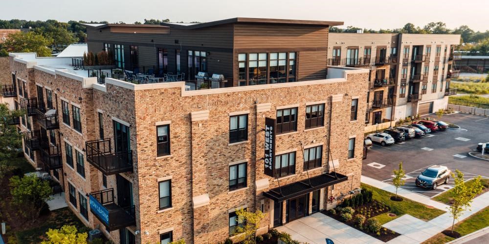 an aerial view of a building with cars parked in a parking lot at Barrington 101, Barrington, IL 60010