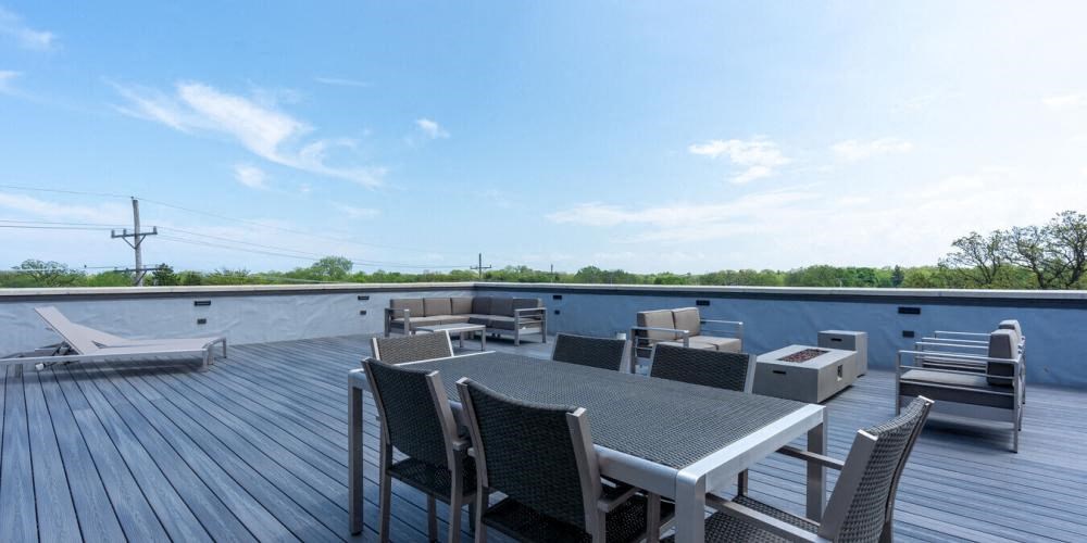 a group of chairs sitting on top of a roof