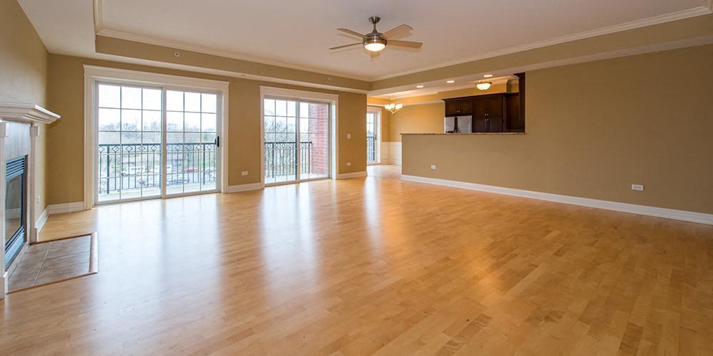 an empty living room with a wood floor and a ceiling fan  at Countryside 10765, Countryside, Illinois