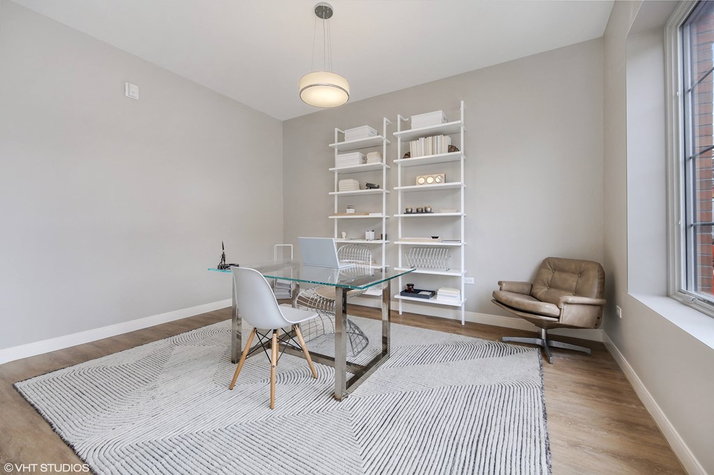 a home office with a glass desk and a chair at Clarendon Hills 229, Clarendon, IL 60514