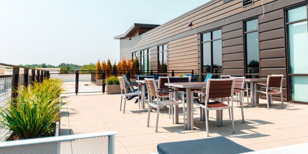 a patio with tables and chairs on a roof at Barrington 101, Illinois, 60010