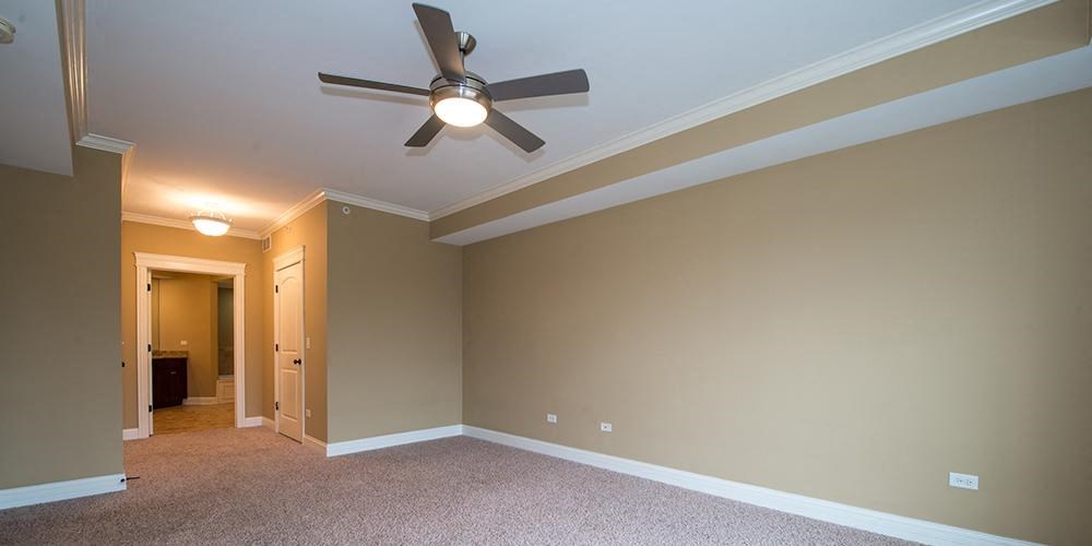 an empty living room with a ceiling fan  at Countryside 10765, Illinois, 60525