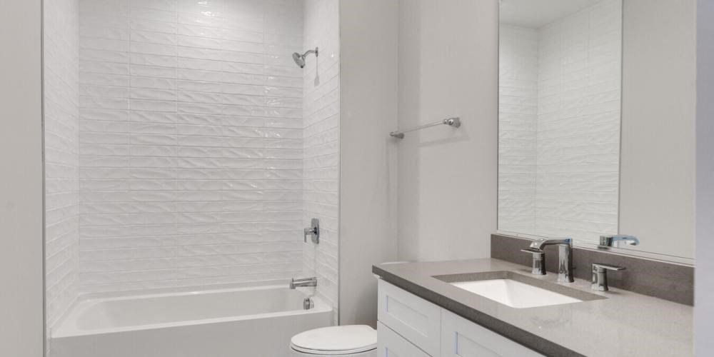 a bathroom with a shower sink and a mirror  at Highwood 246, Highwood, Illinois