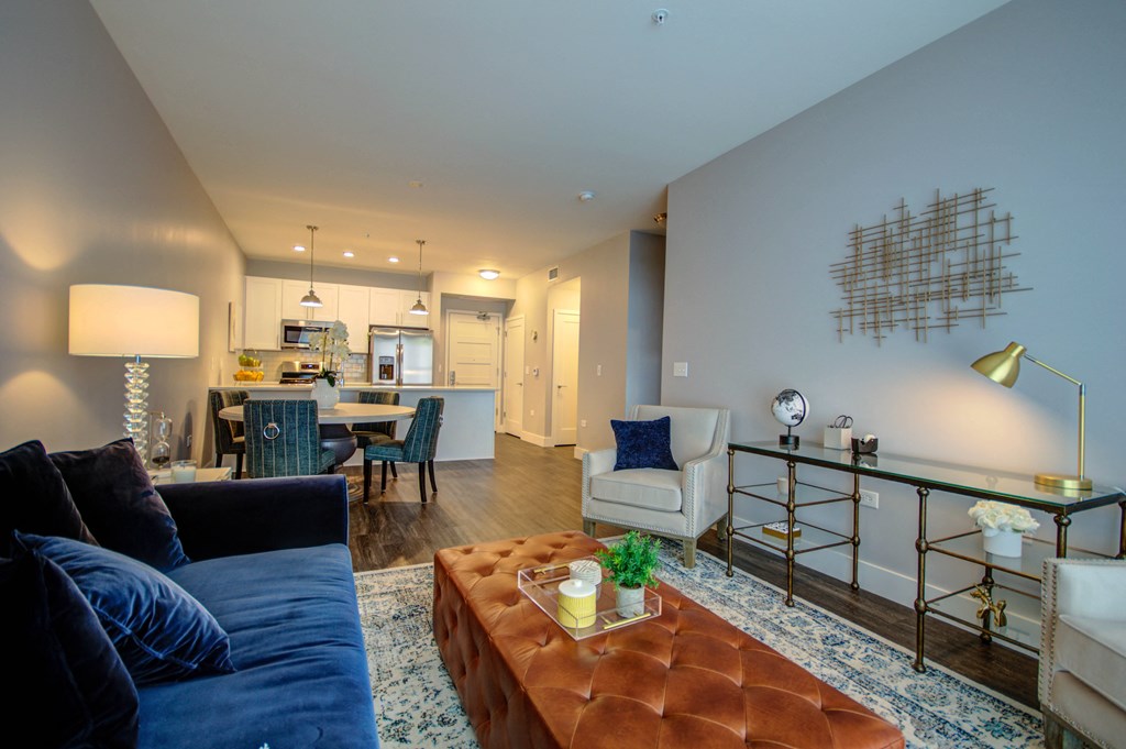 a living room with a couch and a coffee table and a kitchen at Barrington 101, Barrington Illinois