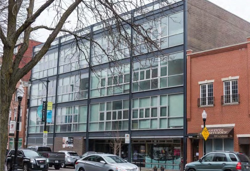 a large glass building with cars parked in front of it  at Fullerton 1540, Chicago, Illinois
