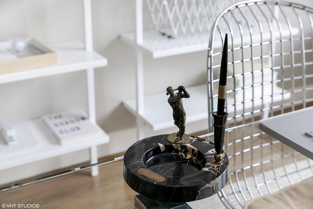 a statue of a person holding a pen on top of a desk at Clarendon Hills 229, Clarendon, 60514