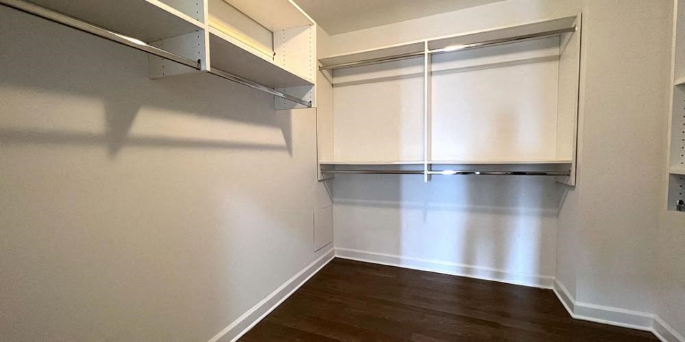 a white room with a closet and a wood floor  at Lavergne 4810, Chicago, 60630