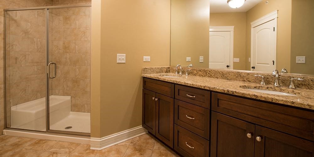 a bathroom with two sinks and a shower  at Countryside 10765, Illinois