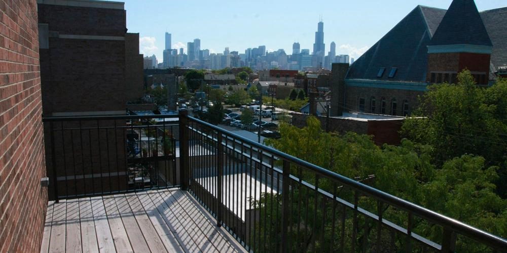 a balcony with a view of a city skyline at West Chicago 1701, Chicago, IL 60622