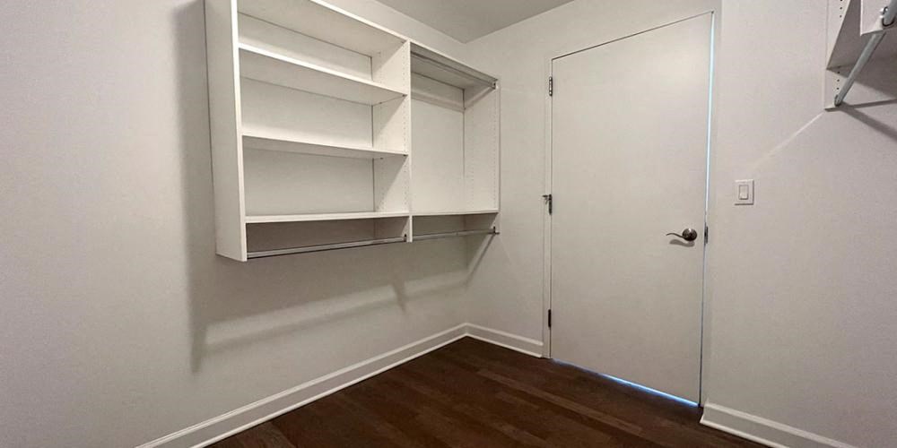 a white room with a closet and a door  at Lavergne 4810, Illinois
