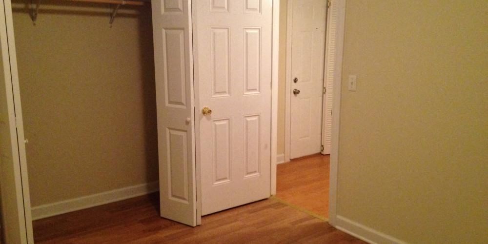 a room with a closet and two doors and a wood floor at Christiana 4954, Chicago Illinois