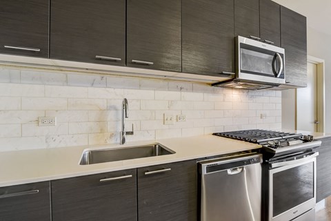 a kitchen with a sink and a stove and a microwave at Clarendon Hills 229, Illinois, 60514
