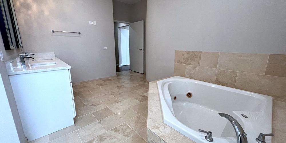 a bathroom with a large tub and a sink  at Lavergne 4810, Chicago, IL, 60630