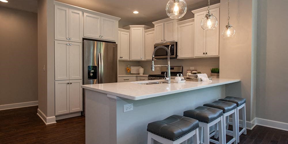 a kitchen with a counter top and a refrigerator at Countryside Townhomes, Countryside, IL 60525