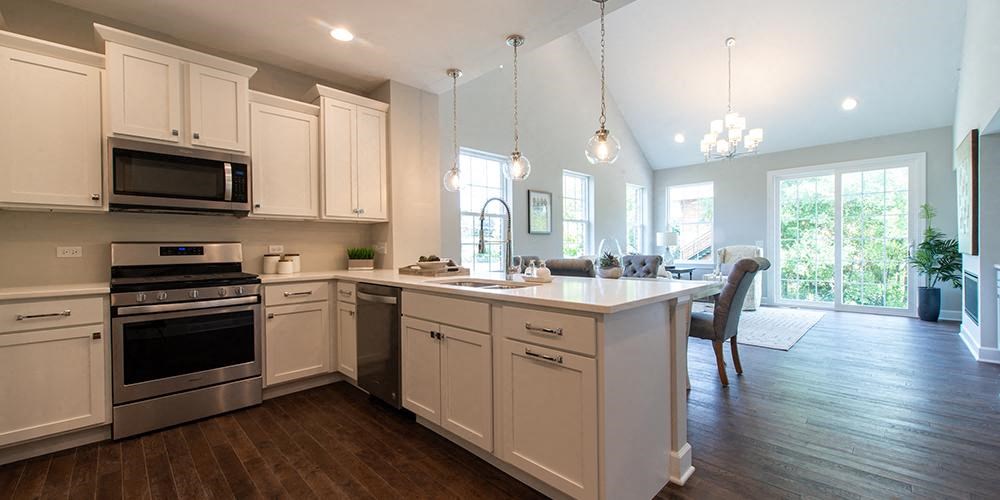 a kitchen with an island and a dining room at Countryside Townhomes, Countryside, 60525