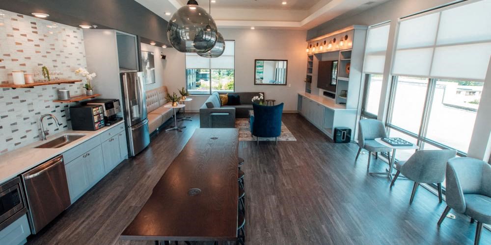 a large living room with a kitchen and a dining room at Barrington 101, Illinois