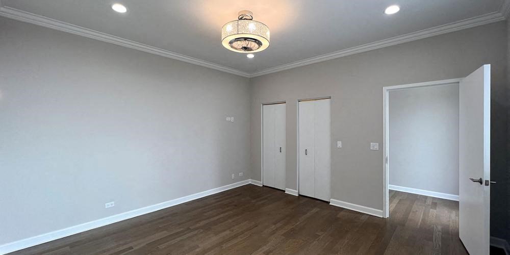 a empty room with white walls and a lamp on the ceiling  at Lavergne 4810, Illinois