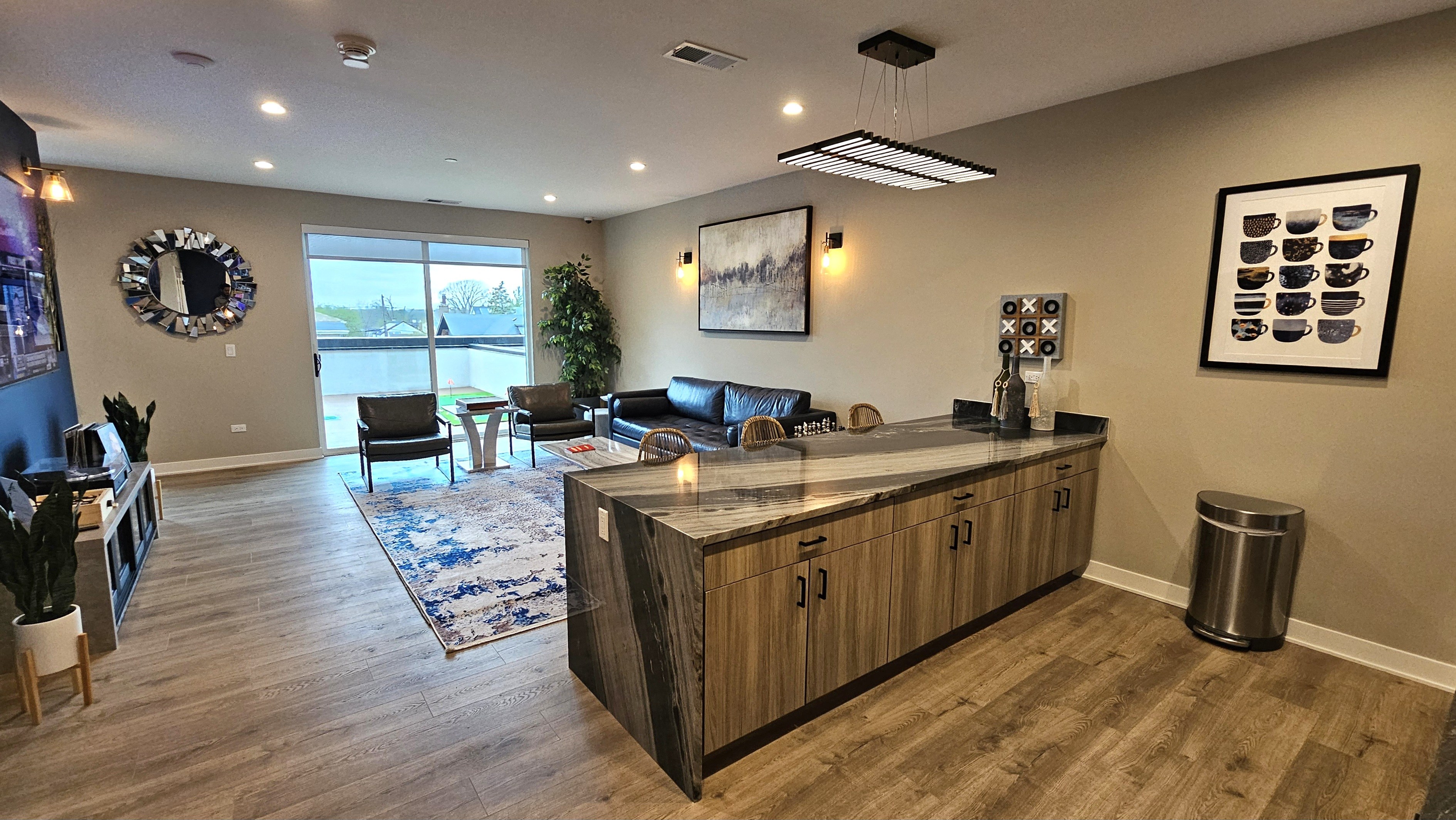 a lobby with a counter and a living room with a couch