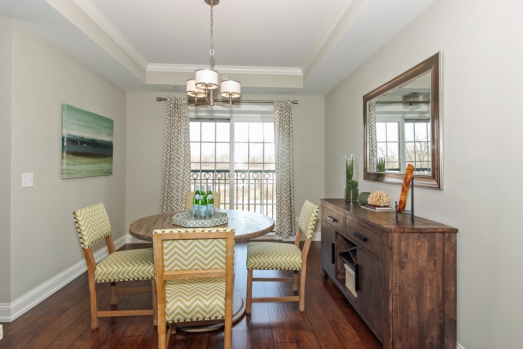 a dining room with a table and chairs and a window  at Countryside 10765, Illinois