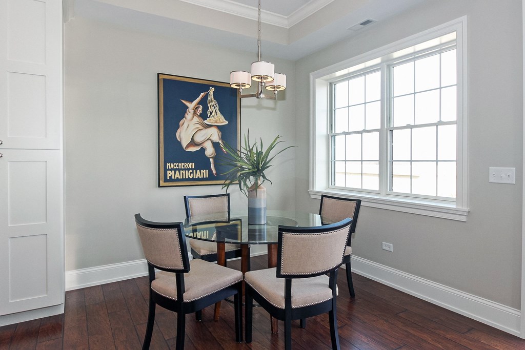 a dining room with a table and chairs and a painting on the wall at Countryside 10765, Countryside