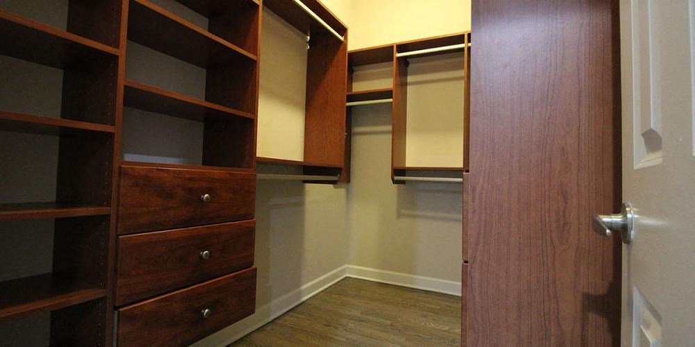 a walk in closet with wooden shelves and  at Elston 3434, Chicago, IL