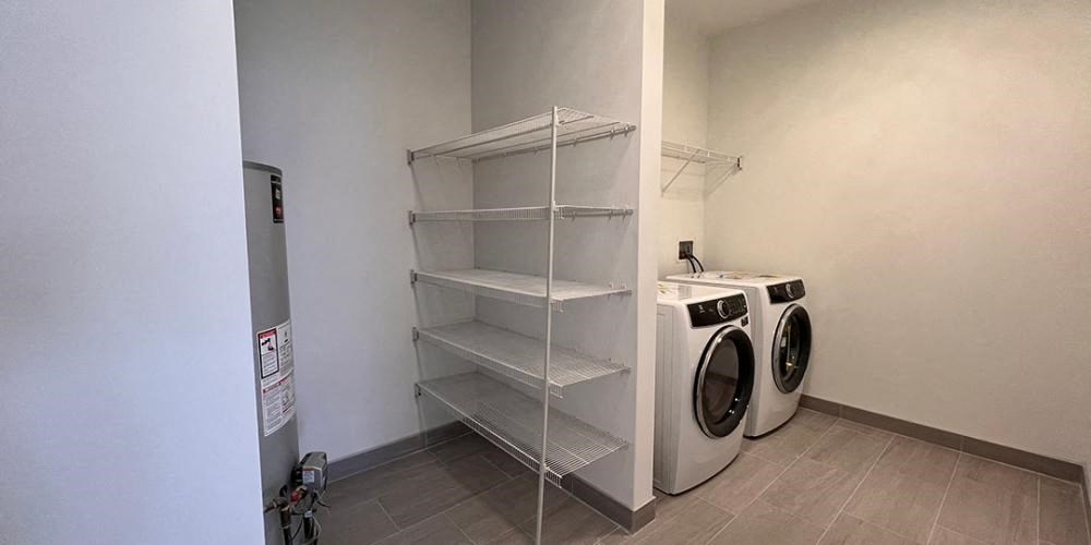 a laundry room with a washer and a white closet  at Lavergne 4810, Chicago, IL, 60630