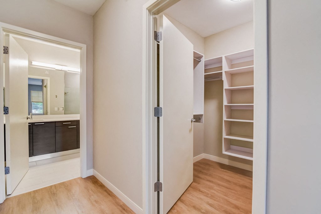 a bedroom with a closet and a bathroom with a mirrored door at Clarendon Hills 229, Illinois, 60514