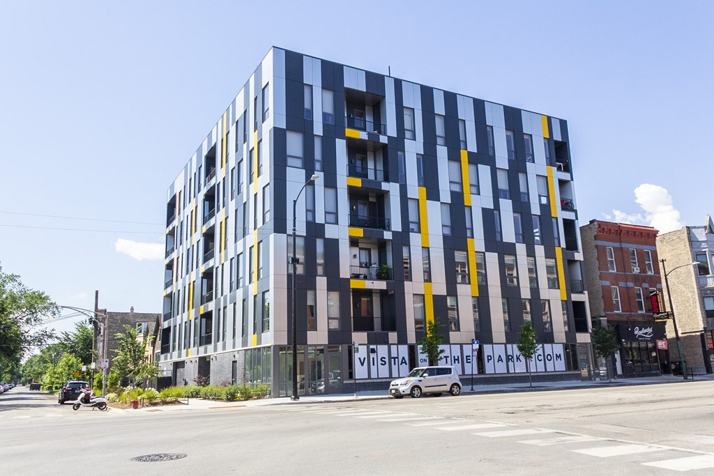 a new apartment building on the corner of a city street at Talman 1554, Chicago, 60622