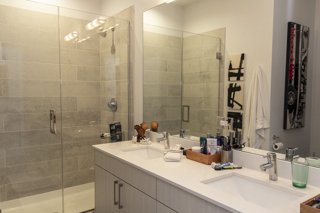 a bathroom with a sink and a shower and a mirror at Talman 1554, Chicago
