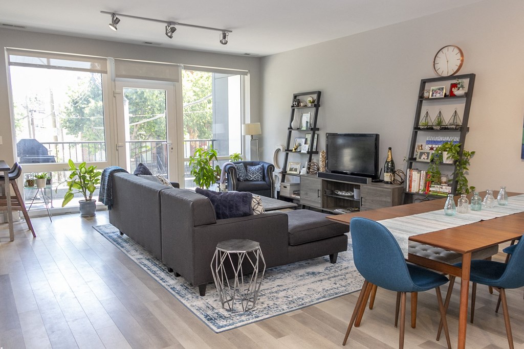 a living room with a couch and a table and a tv at Talman 1554, Illinois