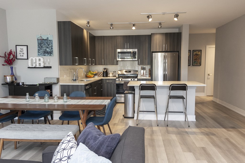 an open kitchen and dining room with a table and chairs at Talman 1554, Illinois