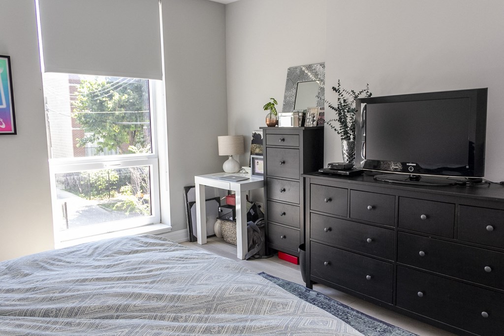 a living room with a black entertainment center and a television at Talman 1554, Chicago, IL