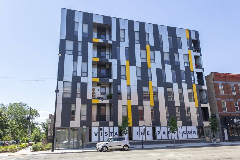 a building with a car parked in front of it on a street at Talman 1554, Chicago Illinois