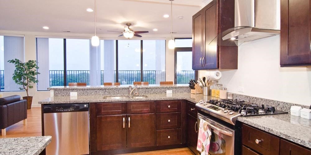 a kitchen with a stove and a sink and a window  at Lavergne 4810, Chicago, 60630