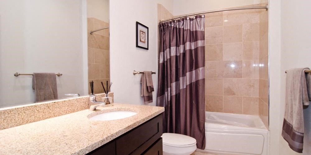 a bathroom with a sink and a shower and a toilet  at Lavergne 4810, Chicago, IL, 60630