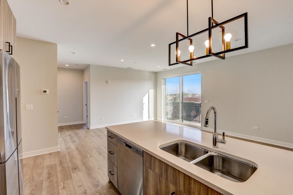 the kitchen is open to the living room and dining room at Highwood 440, Highwood Illinois