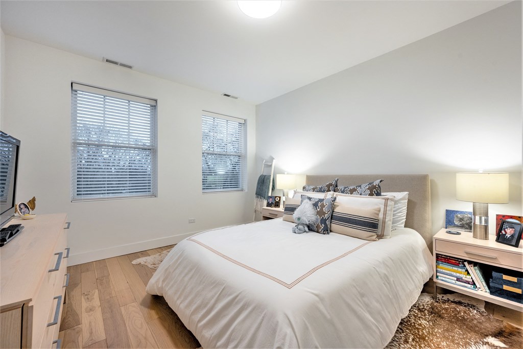 a bedroom with a large bed and a tv at Wilmette 1121, Illinois