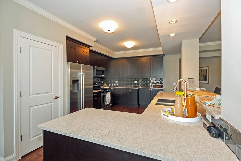 a kitchen with black cabinets and a white counter top  at Countryside 10765, Illinois, 60525